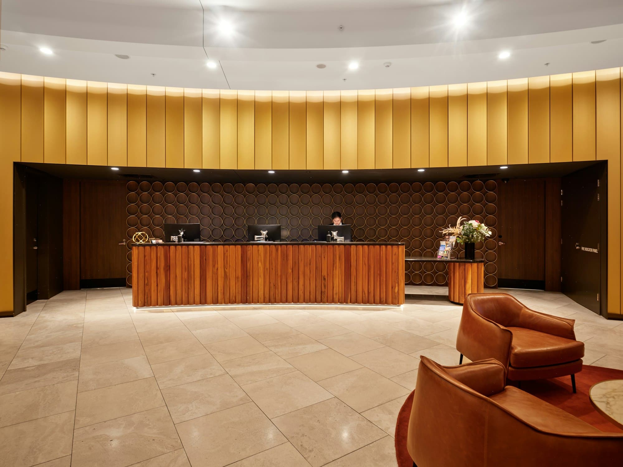 Hotel reception desk with a guest seating area